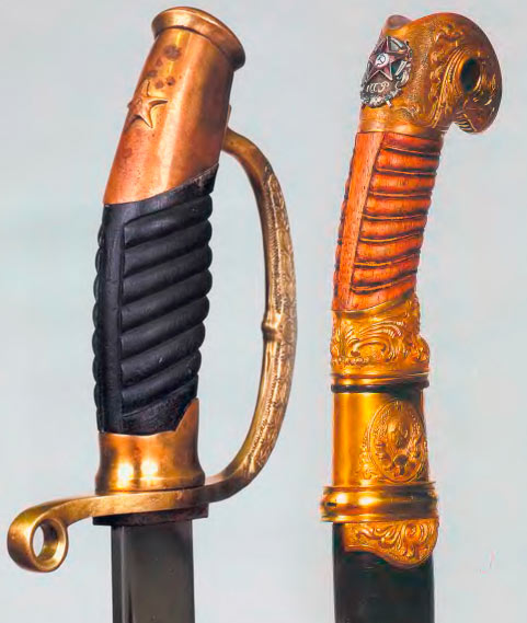Эфесы наградных шашек образца 1927 г. (справа) и 1940 г (слева)