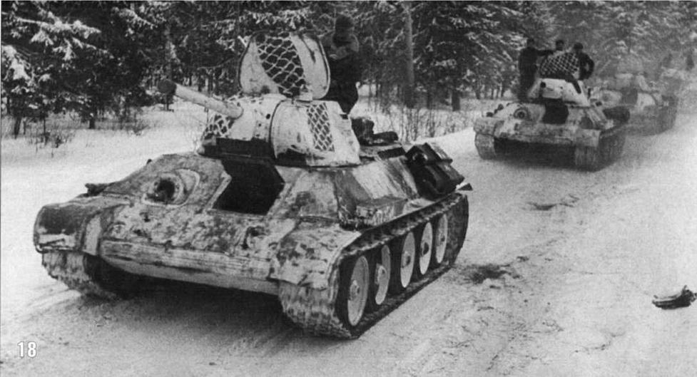 Колонна танков Т-34/76 1-й Гвардейской танковой бригады на марше. Западный фронт. Февраль 1942 г.