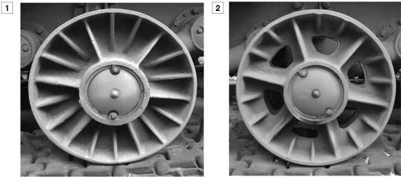 Цельнолитые опорные катки танков КВ-1: 1 — сплошной с ребрами жесткости; 2 — облегченный с ребрами жесткости и вырезами в диске, встречается на машинах выпуска декабря 1941-го — января 1942 года.